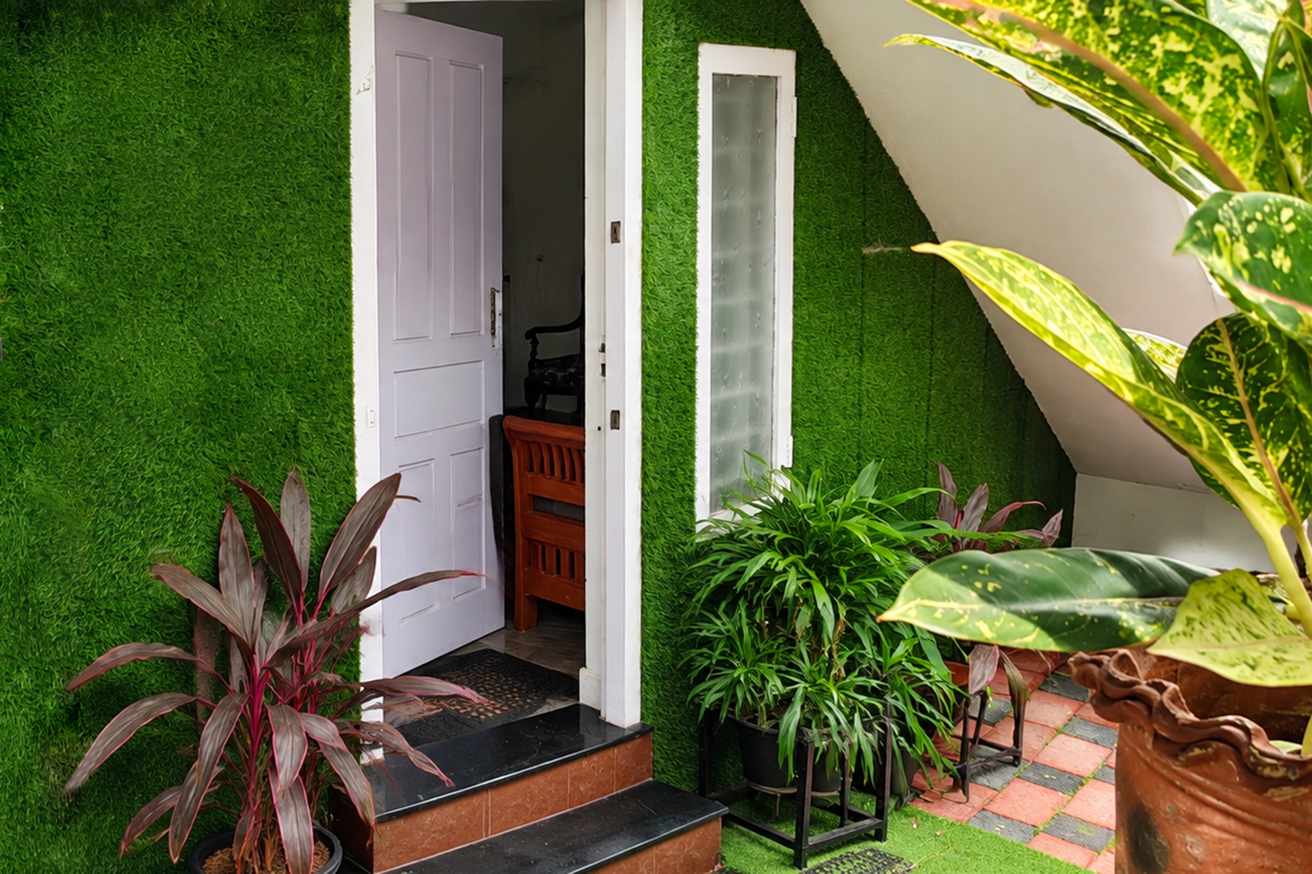Garden pathway and greenery at Misty Garden Homestay on Bishop's Garden Lane, Fort Kochi